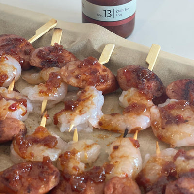 Prawn & Chorizo skewers plated with Simply Stirred chilli jam spread on top