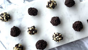 Chocolate and Sticky Date Delite Bites  with white and dark chocolate on a marble surface