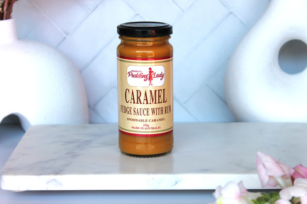 Jar of Pudding Lady caramel fudge sauce with rum on kitchen bench