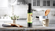 Bottle of Simply Stirred Caramelised Balsamic Dressing displayed on beautiful kitchen bench