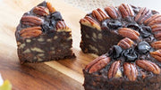 Pudding Lady Chocolate and Pecan cake sliced on wooden board