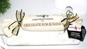 Choc Rum & Raisin pudding log wrapped in calico with ribbons