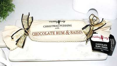 Choc Rum & Raisin pudding log wrapped in calico with ribbons