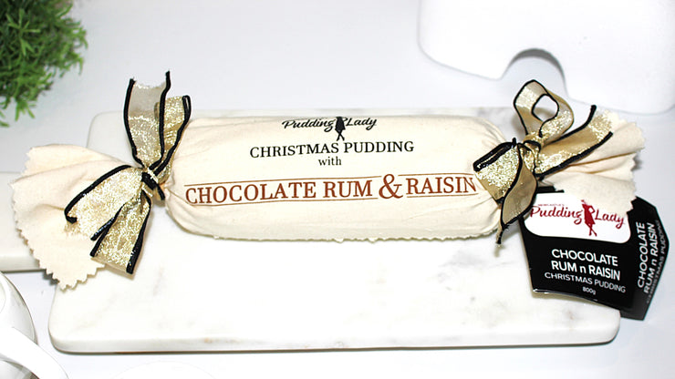 Choc Rum & Raisin pudding log wrapped in calico with ribbons