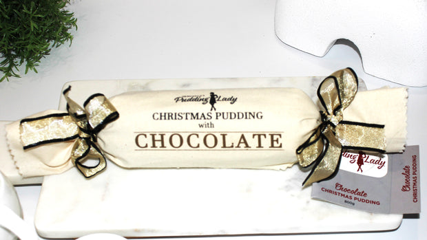 Christmas pudding with chocolate wrapped in calico with a gold bow, branded 'Pudding Lady'.