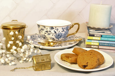 beautifully plated cookies with tea cup and other accessories