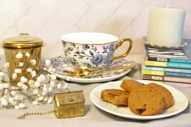 beautifully plated cookies with tea cup and other accessories