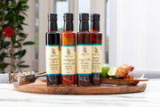 4 delicious simply stirred marinades displayed on wooden plate with chicken skewers