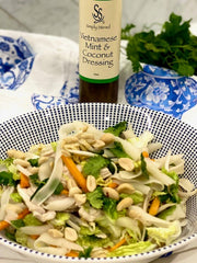 Poached Coconut Chicken with Noodles and Simply Stirred dressing plated beautifully 