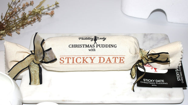 Sticky Date Pudding log wrapped in calico
