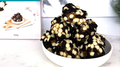 Sticky Date delite bites in white bowl with packaging blurred in background