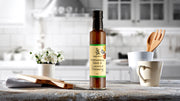 Bottle of Simply Stirred Vietnamese Mint & Coconut Dressing displayed on beautiful kitchen bench 