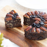 Pudding Lady Chocolate and Pecan cake sliced on wooden board