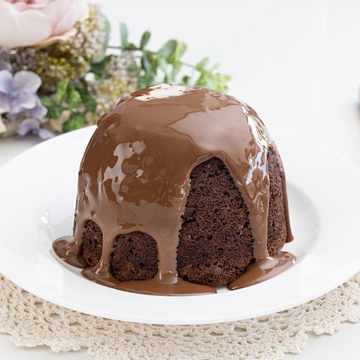 Pudding Lady Chocolate Sponge Pudding on white plate with chocolate sauce dripping over it - perfect gift